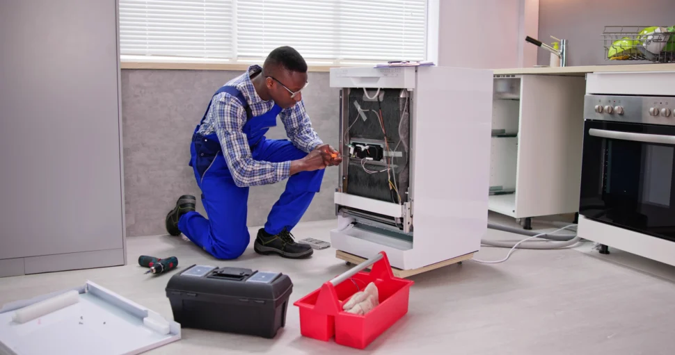 Technician Repairing Dishwasher Appliance